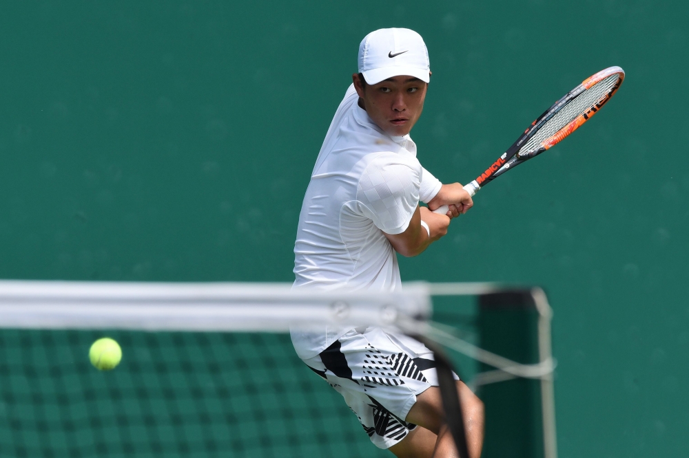 This photo shows Wu Yibing of China hitting a return against Li Zhe during their quarterfinal match at the National Games of China event in Tianjin. China's great new tennis hope Wu Yibing, who made history by winning the US Open boys title, says he hopes to inspire a generation of Chinese players. — AFP