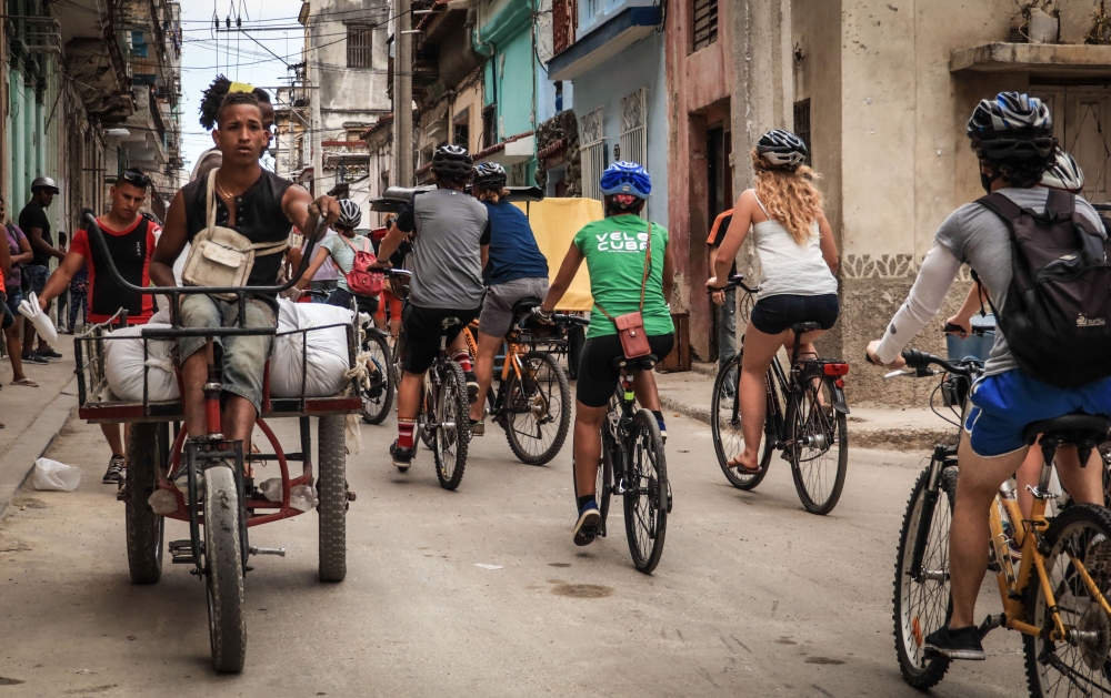 Tourists take a bicycle tour in Havana. A symbol of Cuba's economic crisis, bicycles are gradually coming back into fashion under the impulse of tourists and Cubans often discouraged by the country's poor public transportation system. - AFP