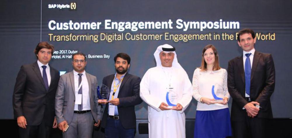 Executives of winning companies with their respective awards