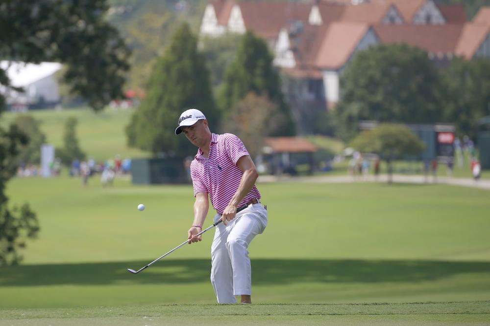 Justin Thomas chips up onto the 6th green during the second round of the Tour Championship Golf Tournament at East Lake Golf Club in Atlanta Friday. — Reuters 