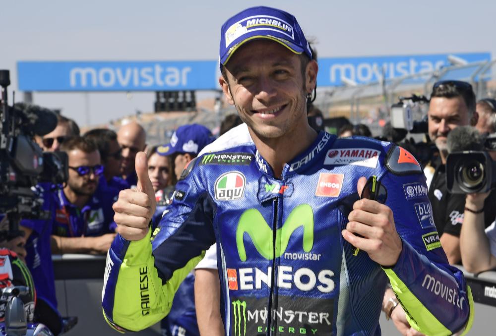Movistar Yamaha MotoGP’s Italian rider Valentino Rossi celebrates being third placed after the practice of the Moto Grand Prix of Aragon at the Motorland circuit in Alcaniz Saturday. — AFP