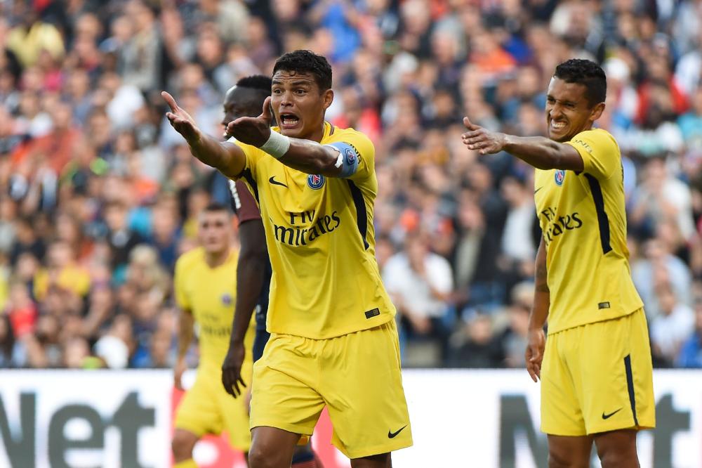 Paris Saint-Germain's defenders Thiago Silva (L) and Marquinhos react during their French Ligue 1 football match against Montpellier at the Stade de la Mosson Stadium in Montpellier, southern France, Saturday. — AFP