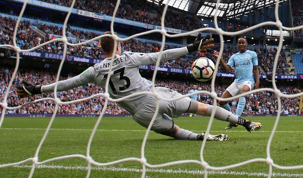 Manchester City's Raheem Sterling scores their second goal against Crystal Palace during their English Premier League match at the Etihad Stadium in Manchester Saturday. — Reuters