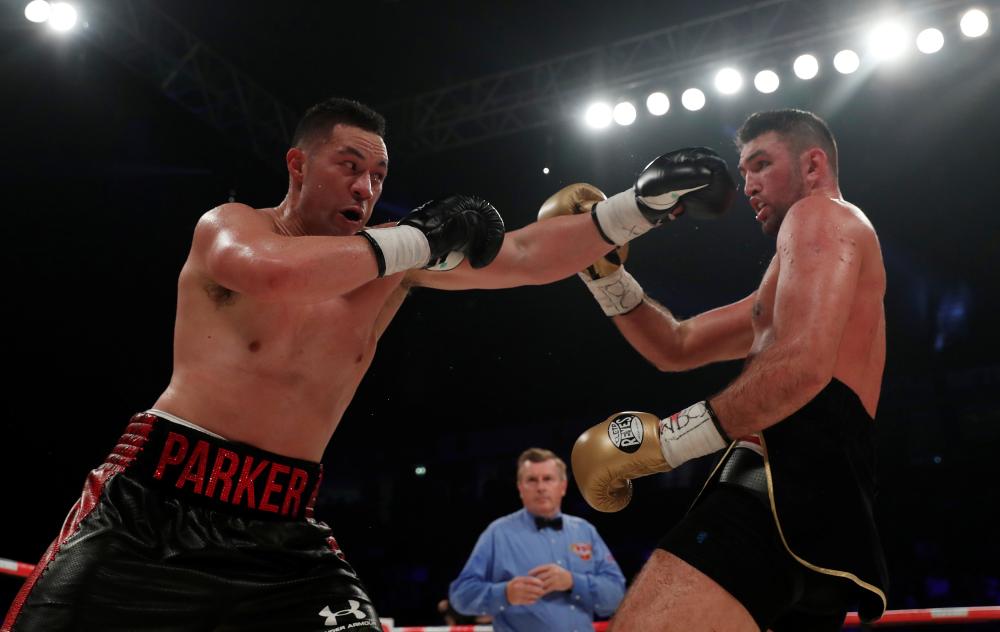 Joseph Parker (L) punches at Hughie Fury during their world heavyweight title at Manchester Arena Saturday. — Reuters