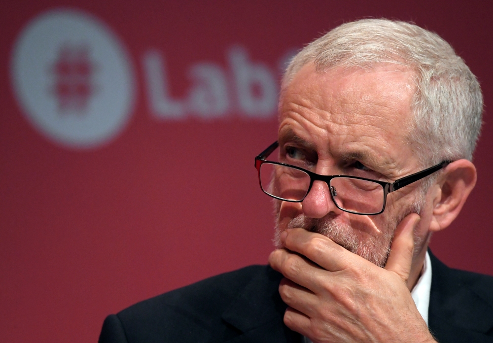 Britain's opposition Labour party leader Jeremy Corbyn listens to a speaker during the Labour party Conference in Brighton, Britain, on Sunday. — Reuters