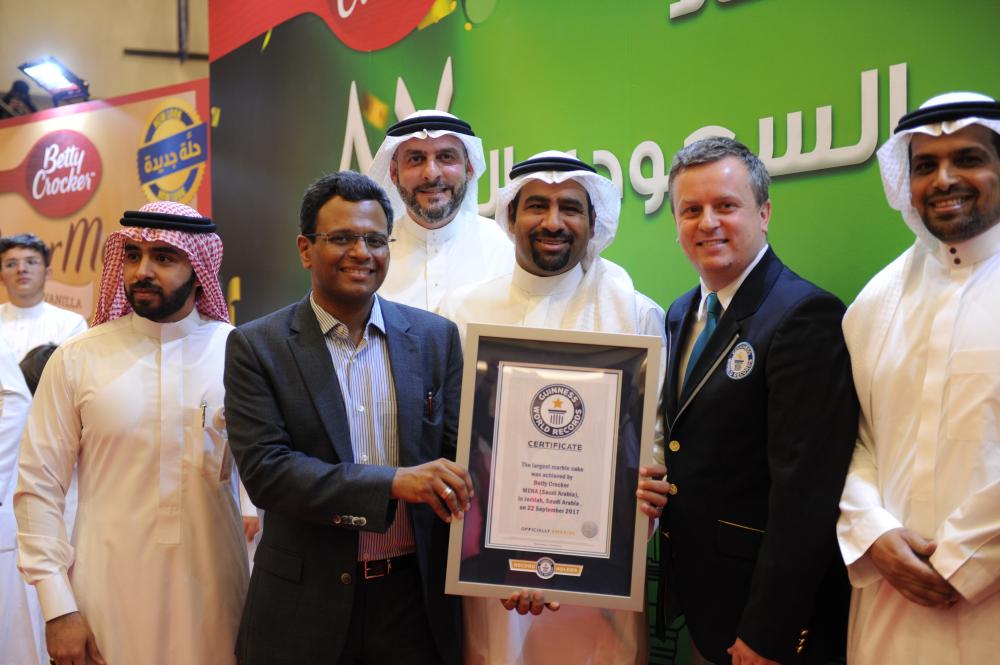 Executives of Betty Crocker and officials of Guinness World Records present the certificate of recognition