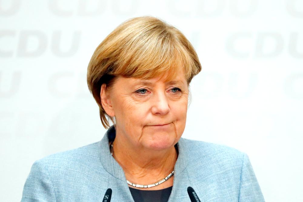 Christian Democratic Union CDU party leader and German Chancellor Angela Merkel addresses a news conference at the CDU party headquarters, a day after the general election (Bundestagswahl) in Berlin, Germany, on Monday. — Reuters