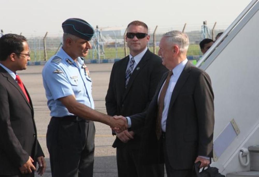 US Defense Secretary Jim Mattis, right, is met by Indian and US officials after arriving at the start of an official visit to India in New Delhi on Monday. — AFP