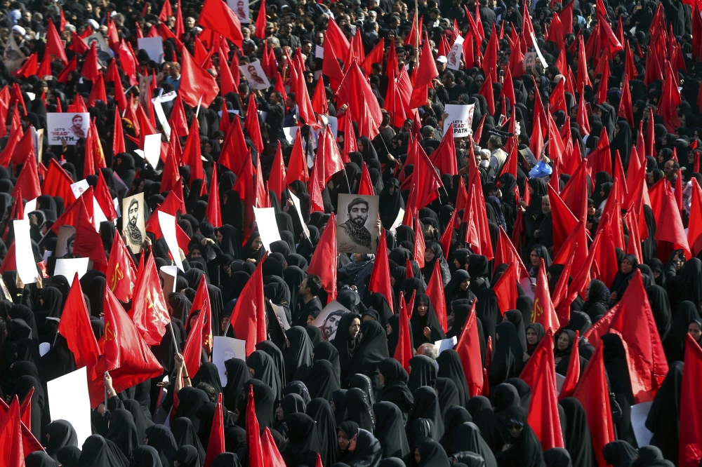Thousands of Iranians attend the state funeral of Mohsen Hojaji, a young Revolutionary Guard soldier beheaded by Daesh, Wednesday, in Tehran, Iran. The death of 25-year-old Mohsen Hojaji has struck a nerve in Iran, which has suffered casualties while its troops are deployed into Iraq fighting Daesh and in Syria. — AP