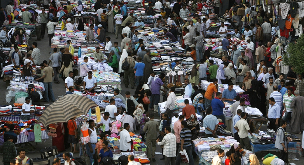 Egyptian citizens walk on a main street in central Cairo in this file photo. — Reuters