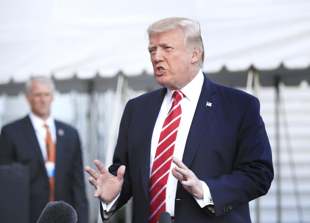 US President Donald Trump speaks to reporters before leaving the White House in Washington for a brief stop at Andrews Air Force Base in Maryland, on his way to Greensboro, North Carolina, on Saturday. — AP