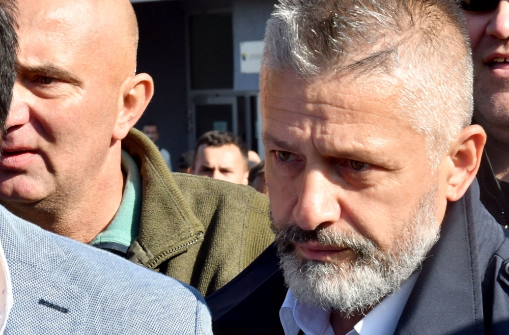 Naser Oric, wartime commander of Bosnian Muslim forces in the area of Srebrenica and Bratunac, leaves court in Sarajevo on Monday. — AFP