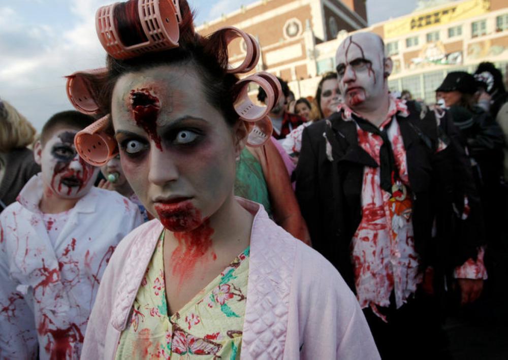 Participants dressed as zombies take part in the annual zombie walk in Asbury Park, New Jersey on Monday.