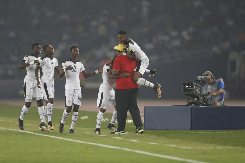 Ghana's players and coach celebrate a goal during the FIFA U-17 World Cup match against India in New Delhi Thursday. — AP