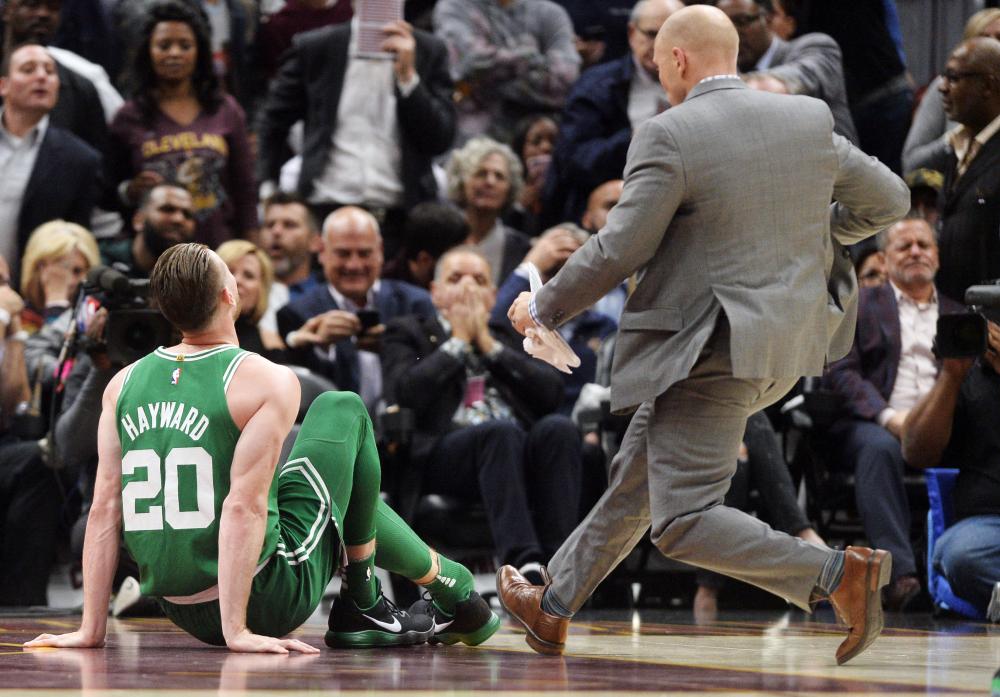 Boston Celtics’ forward Gordon Hayward sits on the court after injuring his ankle during the first half against the Cleveland Cavaliers at Quicken Loans Arena in Cleveland Tuesday. — Reuters 