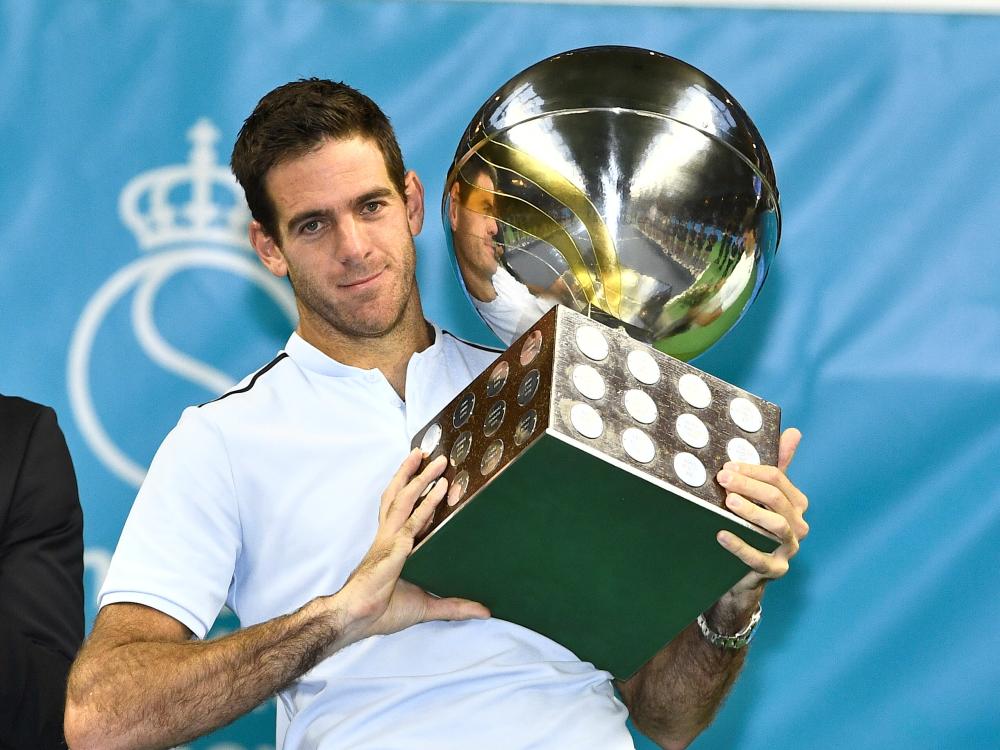 Juan Martin Del Potro of Argentina holds the trophy after beating Grigor Dimitrov of Bulgaria in the final of the Stockholm Open at the Royal Tennis Hall in Stockholm Sunday. — Reuters