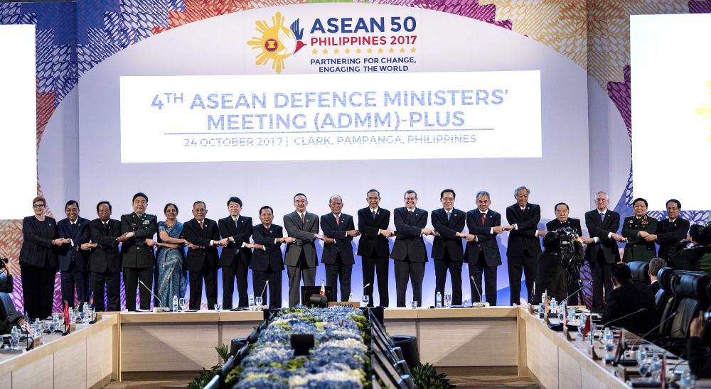 The 11th Association of Southeast Asian Nations (ASEAN) Defense Ministers (ADMM) and 4th ADMM-Plus (L to R): Australia's Defense Minister Marise Ann Payne, Brunei's Minister of Energy and Industry Haji Mohammad Yasmin Bin Haji Umar, Cambodia's Defense Minister and Deputy Prime Minister Samdech Pichey Sena Tea Banh, China's National Defense Minister Chang Wanquan, India's Defense Minister Nirmala Sitharaman, Indonesia's Defense Minister Ryamizard Ryacudu, Japan's Defense Minister Itsunori, Lao Defense Minister Chansamone Chanyalath, Malaysia's Defense Minister Dato’ Seri Hishammuddin Bin Tun Hussein, Philippines' Defense Secretary and Chairman of the ASEAN Defense Ministers' Meeting Delfin Lorenzana, Myanmar's Defense Minister Sein Win, New Zealand's Defense Secretary Deputy Tony John Lynch, South Korea's National Defense Minister Song Young-Moo, Russia's Minister of Defense Sergei Shoigu, Singapore's Defense Minister Ng Eng Hen, Thailand's Defense Minister and Deputy Prime Minister Prawit Wongsuwan, US Defense Secretary James Mattis, Vietnam's DefenSe Minister Ngo Xuan Lich and ASEAN Secretary General Le Luong Minh link arms on Clark, east of Manila on Tuesday. — AFP 