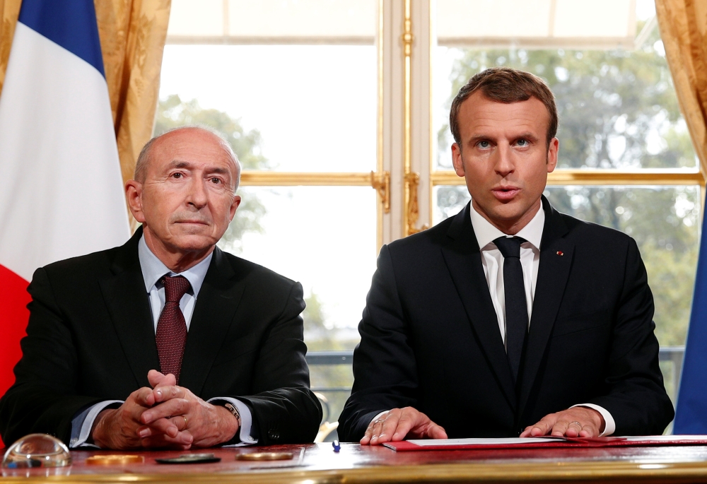 French President Emmnauel Macron (R) addresses the media with French Interior Minister Gerard Collomb (L) after signing a new anti-terrorism and interior security law at the Elysee Palace in Paris, France, on Monday. — Reuters