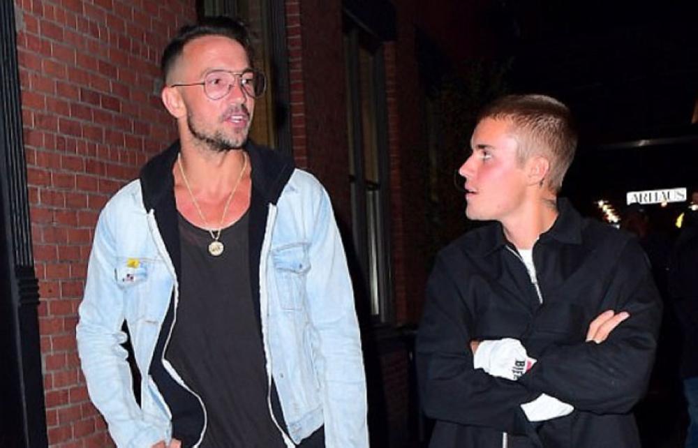 Carl Lentz and Justin Bieber are seen walking together in this undated file photo.