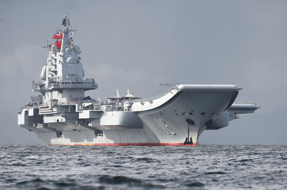 This file photo t shows China's sole aircraft carrier, the Liaoning, arriving in Hong Kong waters, less than a week after a high-profile visit by president Xi Jinping. Chinese President Xi Jinping's pledge to build a 