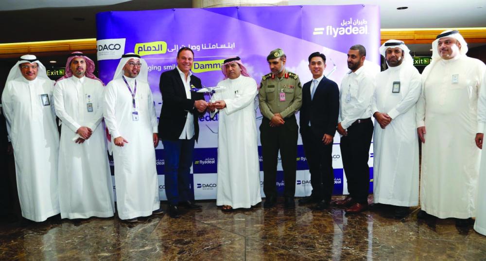 Executives and CEO of Dammam Airport Company (DACO) with Flyadeal officials at KFIA exchange mementos
