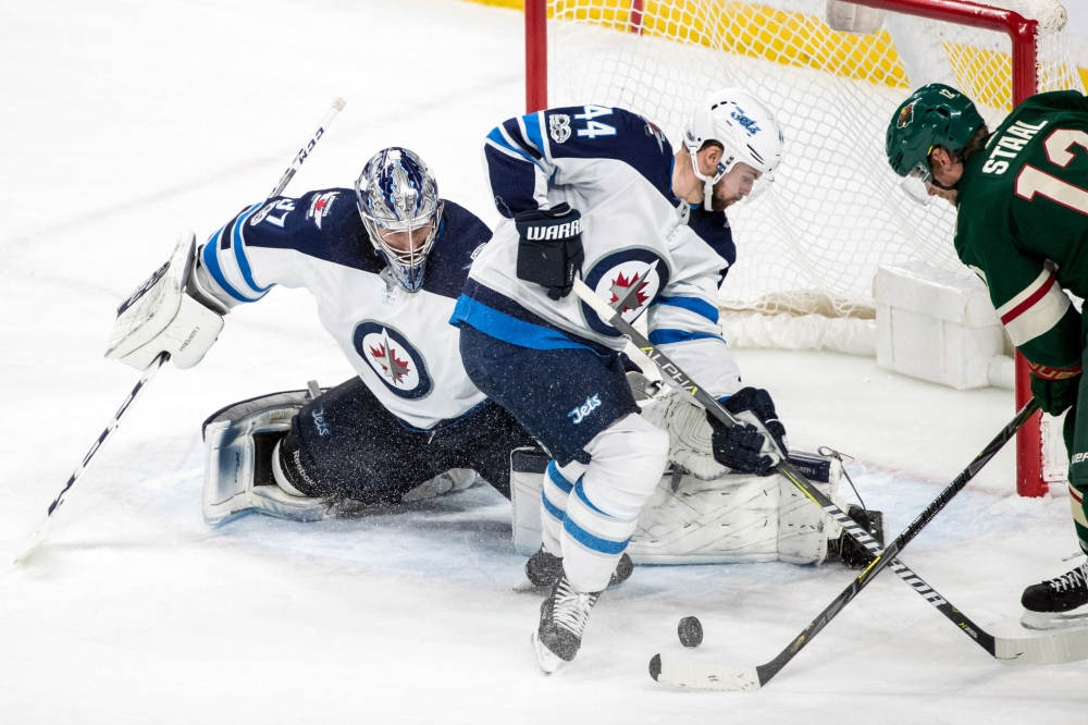 Winnipeg Jets goalie Connor Hellebuyck (37) makes a save during the third period against the Minnesota Wild at Xcel Energy Center. — Reuters