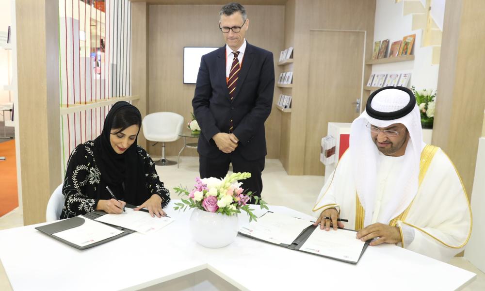 Sheikha Bodour bint Sultan Al Qasimi, Founder and President of the Emirates Publishers Association, EPA, and Dr. Sultan bin Ahmad Sultan Al Jaber, Minister of State and Chairman of the National Media Council, NMC, sign a Memorandum of Understanding, MoU, between their respective bodies.