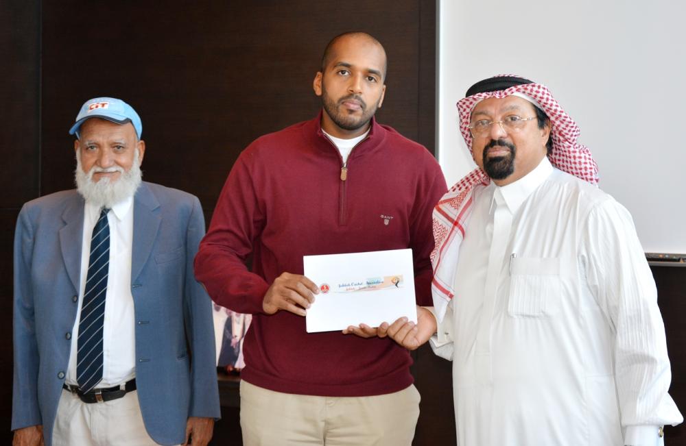 Naser Gulaid, CEO of CIT Group, handing over the sponsorship documents to Dr. Faiz Al Abideen and Muhammad Iqbal of JCA. — Courtesy photo