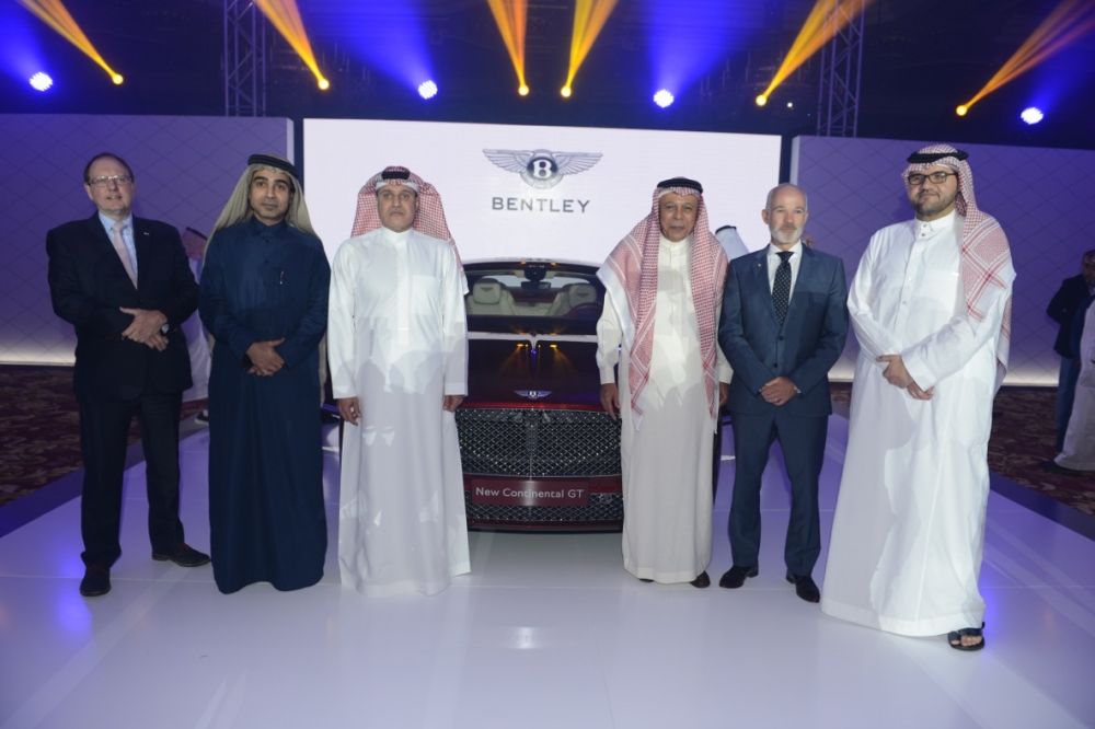 
Sheikh Mohammed Wajih Sharbatly, CEO of Al Nahla Group; Stephen Reynolds, Regional Director, Middle East and Asia Pacific for Bentley Motors, and other top officials pose for a group photo with the all-new Continental  GT in the background during the announcement held at Laylaty Hall in Jeddah
