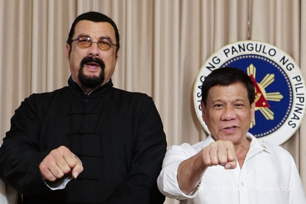 Philippine President Rodrigo Duterte, right, is seen with Hollywood actor Steven Seagal during a courtesy call at Malacanang Palace in Manila on Sunday. — AFP