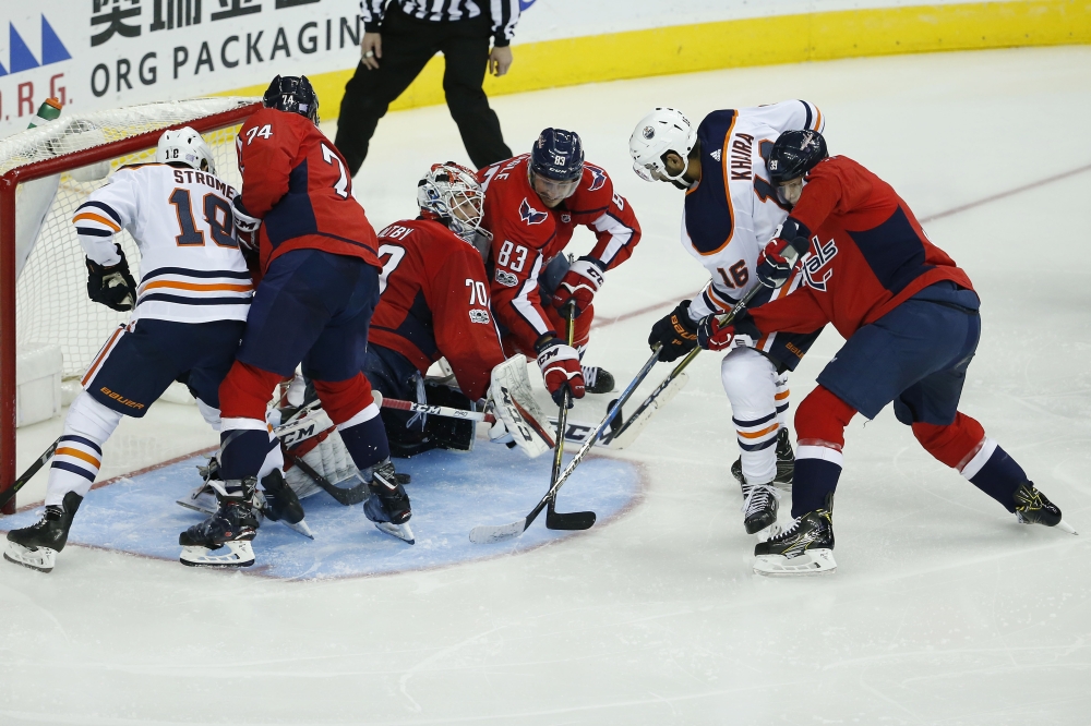 Edmonton Oilers left wing Jujhar Khaira (16) scores a goal past Washington Capitals goalie Braden Holtby (70) during the third period at Capital One Arena. The Capitals won in a shootout 2-1. — Reuters