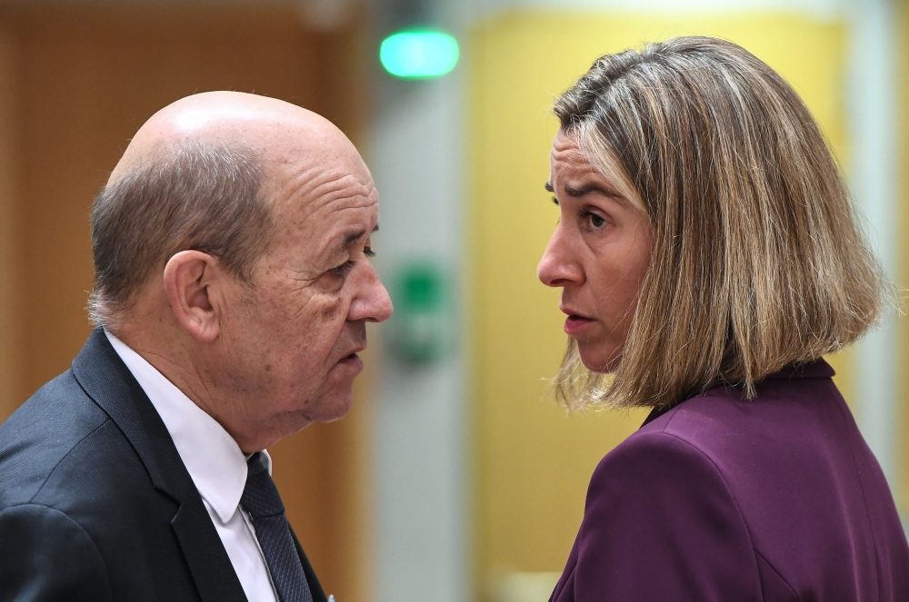 France’s Foreign Minister Jean-Yves Le Drian, left, and EU Foreign Policy Chief Federica Mogherini attend a foreign/defense affairs council at the European Council in Brussels on Monday. — AFP