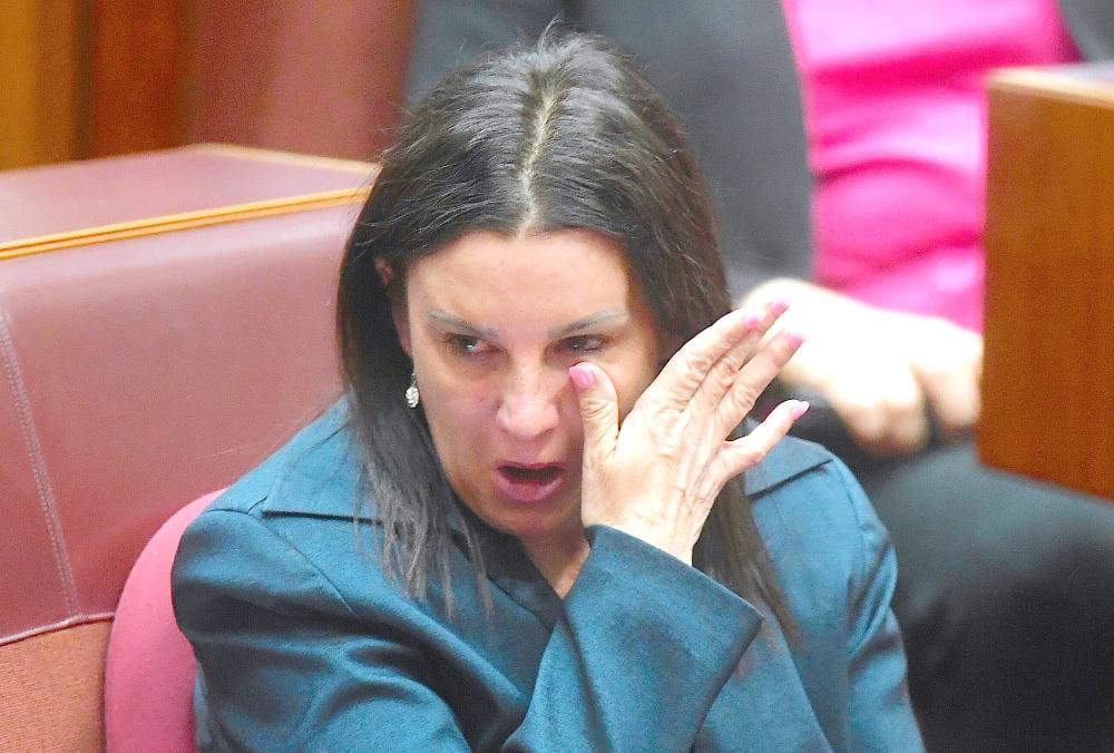 Jacqui Lambie, an independent and outspoken senator for the island state of Tasmania, reacts after delivering a statement regarding her resignation in the Senate chamber at Parliament House in Canberra, Australia, on Tuesday. — Reuters