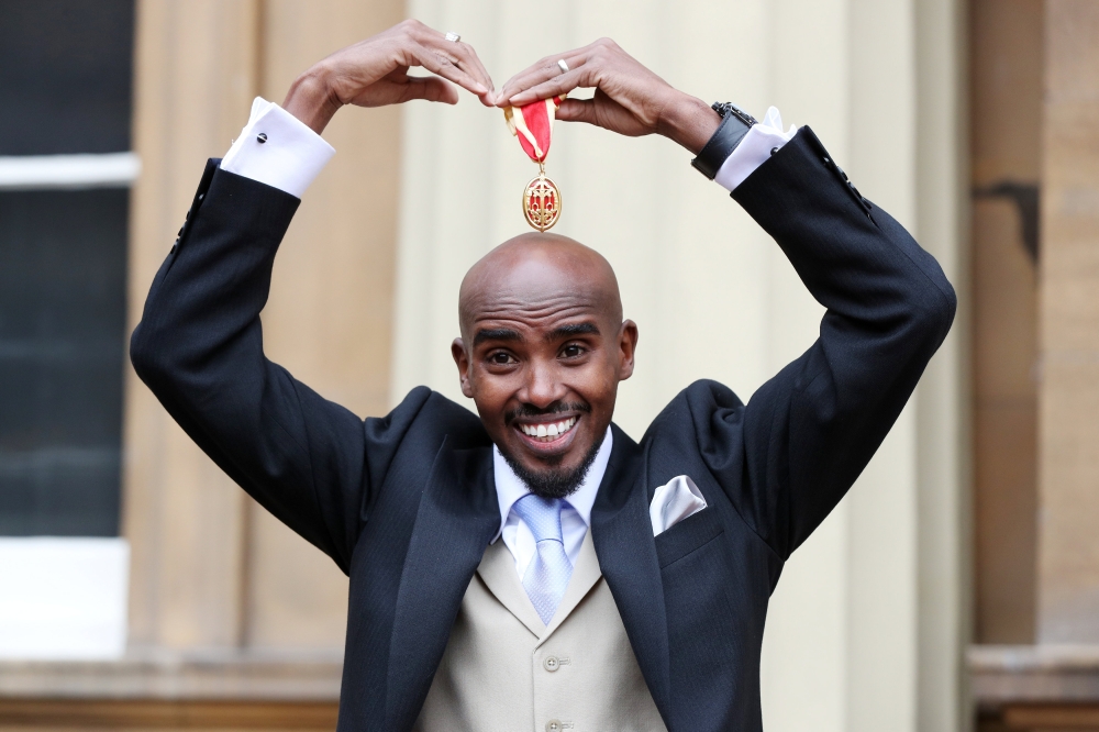 Mo Farah poses after he received his knighthood from Britain's Queen Elizabeth at Buckingham Palace, London, on Tuesday. — Reuters
