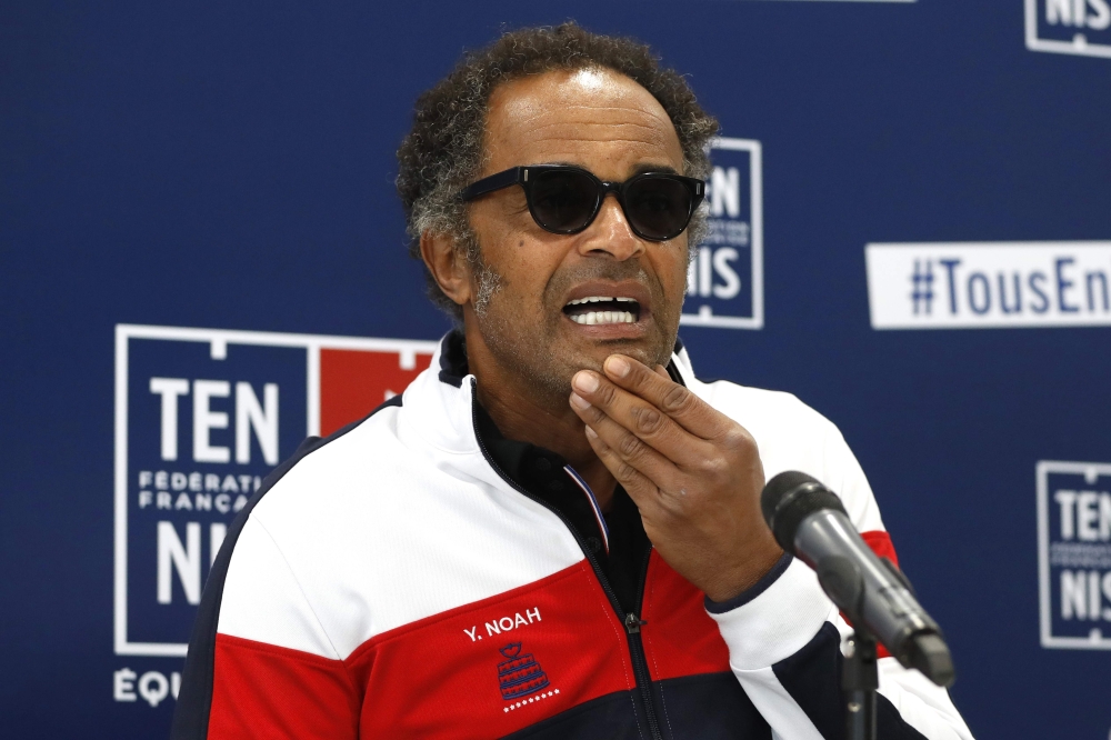 France's captain Yannick Noah reacts during a press conference in Paris on Tuesday to unveil France team for Davis Cup final. — AFP