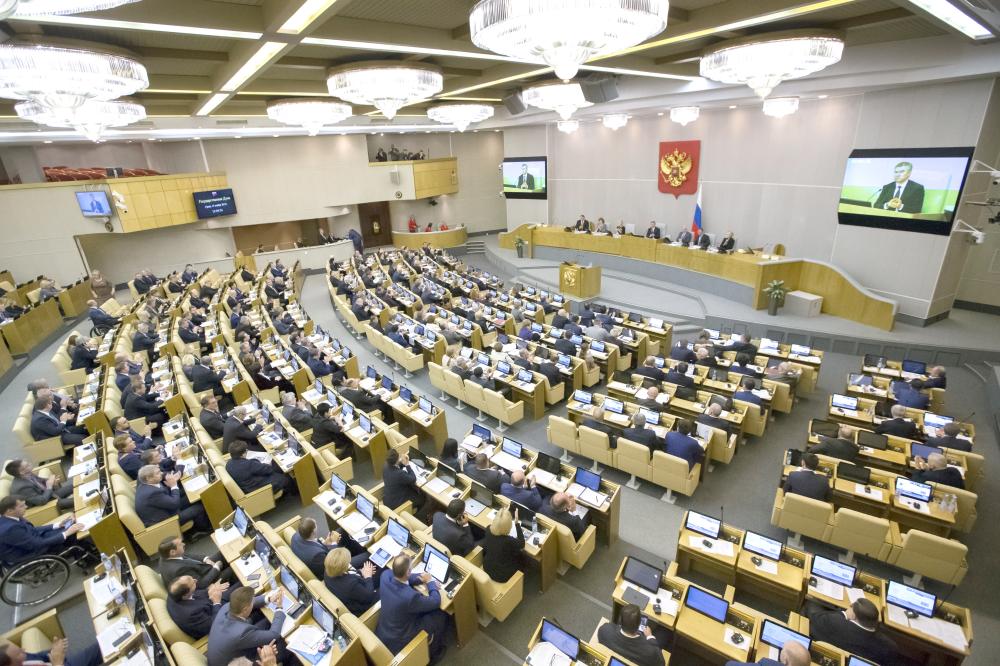 Russian lawmakers applaud after voting in the State Duma, the Lower House of the Russian Parliament in Moscow, Russia, on Wednesday. — AP