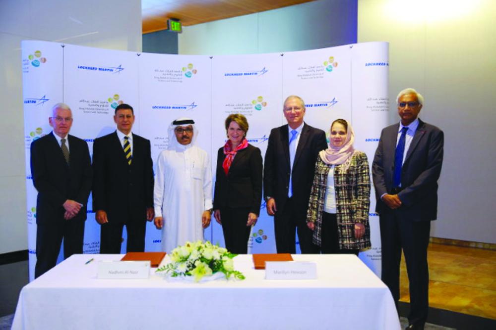 Lockheed Martin Chairman, President and Chief Executive Officer Marillyn Hewson and KAUST Acting President Nadhmi Al-Nasr pose for a group photo with other officials after the signing of agreement