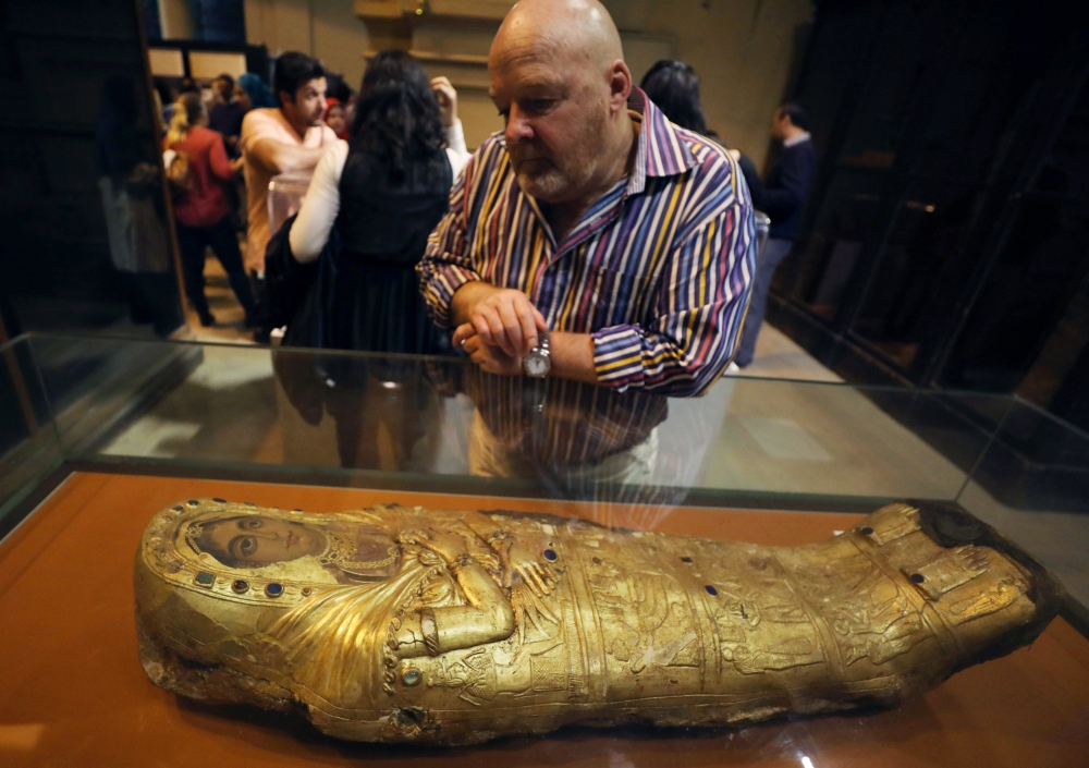 A visitor looks at artefacts inside the Egyptian Museum in Cairo. — Reuters