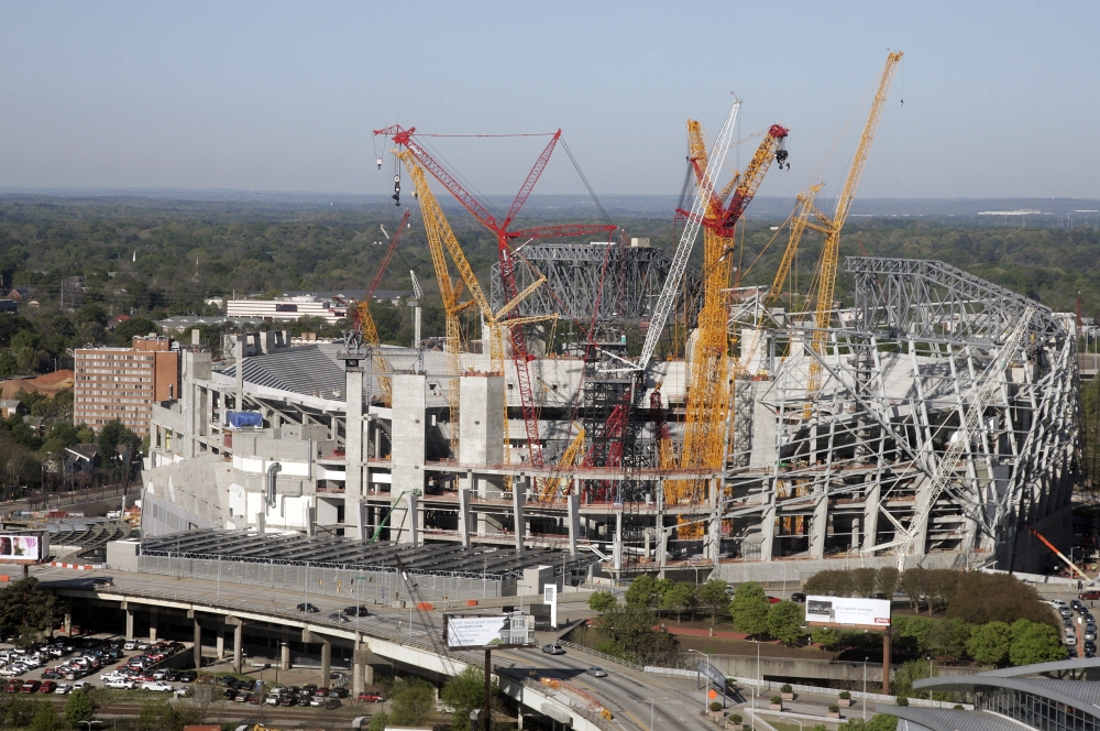In this file photo, construction crews work on the the Mercedes-Benz stadium, in Atlanta. The new $1.5 million stadium is home to the National Football League's Atlanta Falcons and Major League Soccer's Atlanta United. It features a retractable roof; a 1,100-foot 