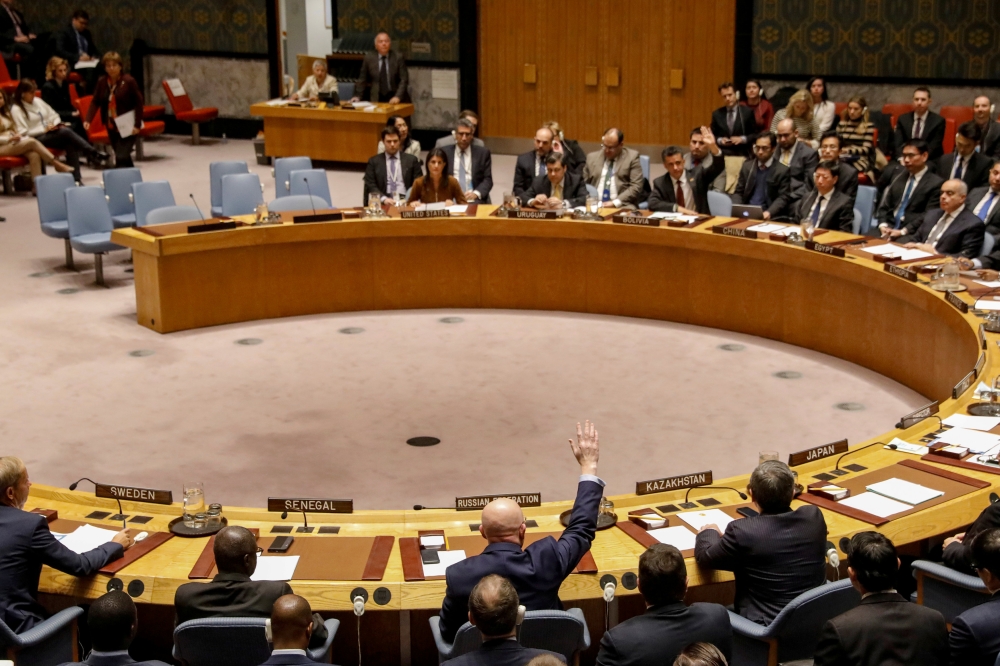 Russian Ambassador to the United Nations Vasily Nebenzya votes against a bid to renew an international inquiry into chemical weapons attacks in Syria, during a meeting of the UN Security Council at the United Nations headquarters in New York on Friday. — Reuters