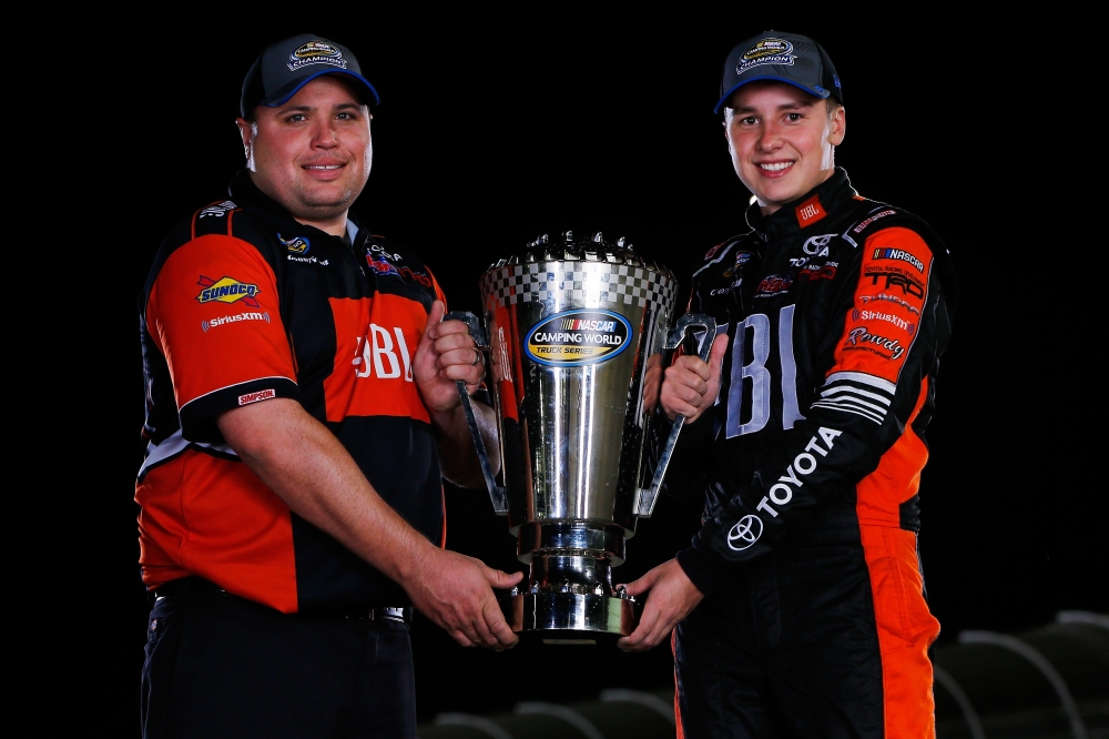 Crew chief crew chief Ryan Fugle and Christopher Bell, driver of the No. 4 JBL Toyota, poses with the trophy after winning the Camping World Truck Series Championship during the NASCAR Camping World Truck Series Championship Ford EcoBoost 200 at Homestead-Miami Speedway on Friday in Homestead, Florida. — AFP