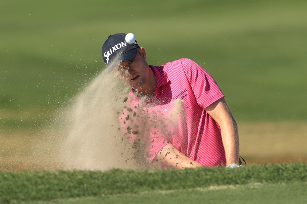 Russell Knox of Scotland plays a shot from a bunker on the 15th hole during the second round of The RSM Classic at Sea Island Golf Club Seaside Course on Friday in St Simons Island, Georgia. — AFP