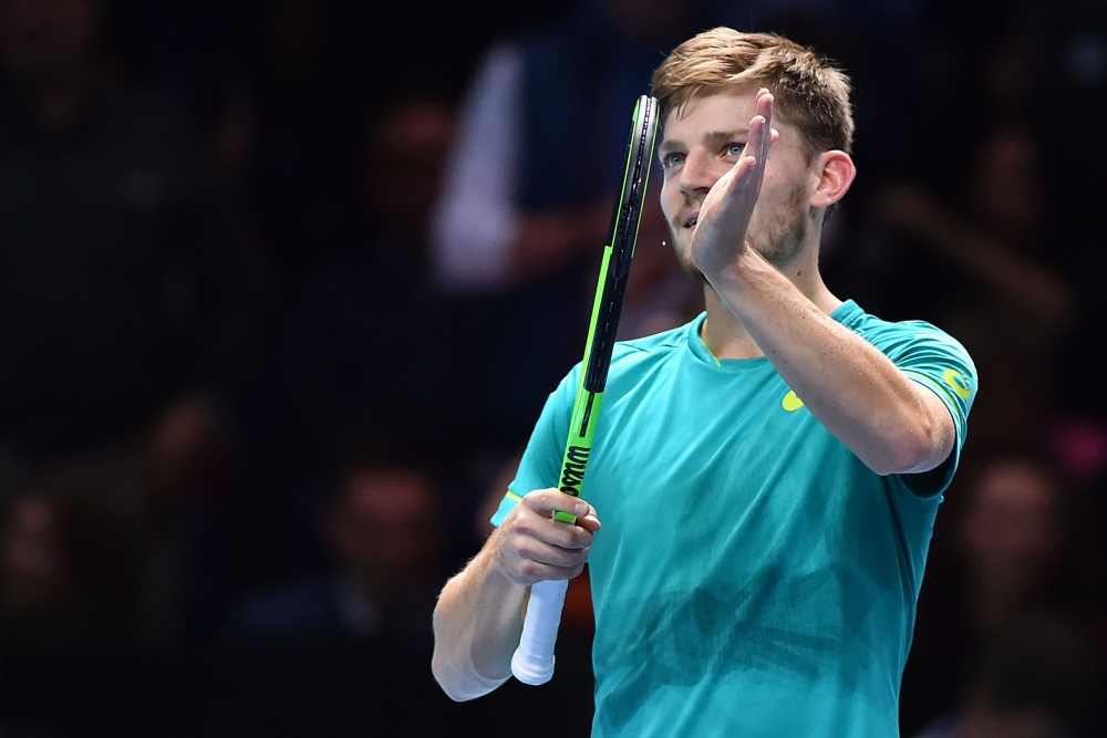 Belgium's David Goffin gestures to the crowd after his straight sets win over Austria's Dominic Thiem in their men's singles round-robin match on day six of the ATP World Tour Finals tennis tournament at the O2 Arena in London on Friday. — AFP