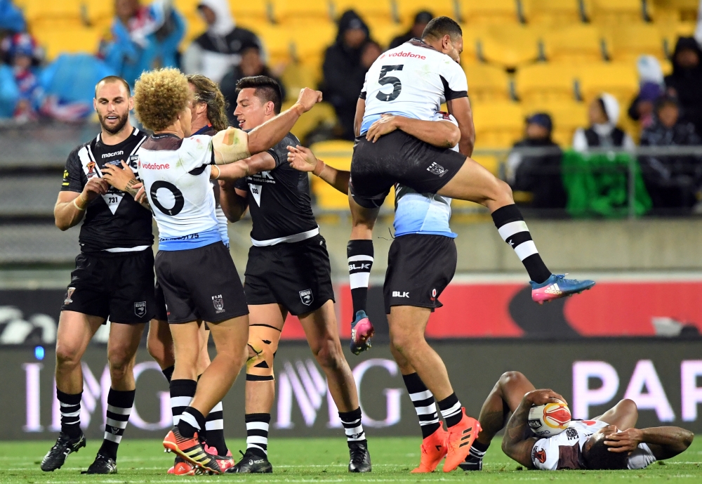 Fiji players celebrate after defeating New Zealand in their quarterfinal match against New Zealand in the Rugby League World Cup at the Wellington Regional Stadium, Wellington, on Saturday. — Reuters