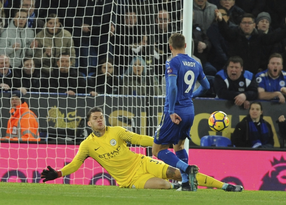 Leicester's Jamie Vardy, right, fails to beat Manchester City's goalkeeper Ederson Moraes during the English Premier League soccer match between Leicester City and Manchester City at the King Power Stadium in Leicester, England, Saturday. — AP