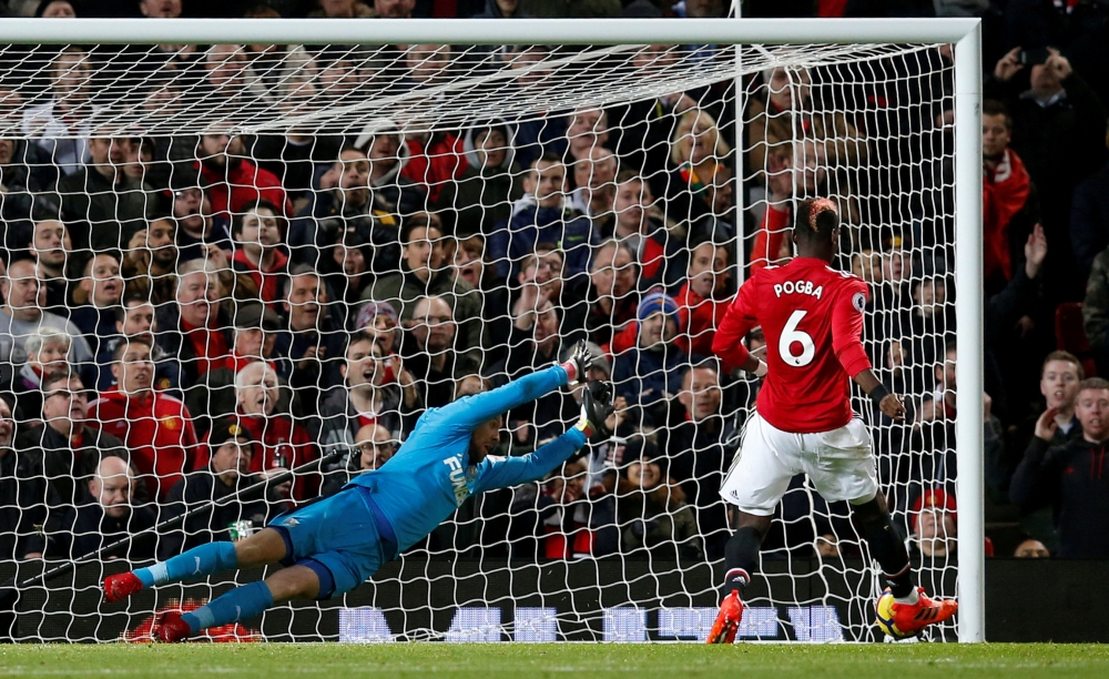 Manchester United's Paul Pogba scores their third goal against Newcastle United in the English Premier League encounter at Old Trafford on Saturday. — Reuters
