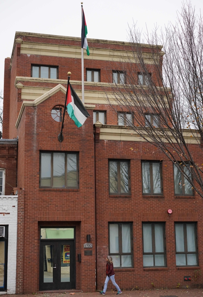 The flag of the Palestine Liberation Organization (PLO) is seen above its offices in Washington, DC, on Saturday. — AFP