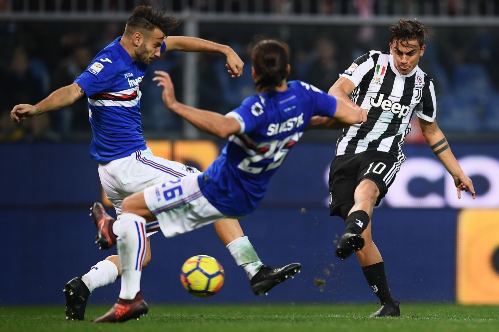 Juventus' forward Paulo Dybala from Argentina (R) scores during the Italian Serie A football match against Sampdoria on Sunday at the 'Luigi Ferraris' Stadium in Genoa. Sampdoria won 3-2. — AFP