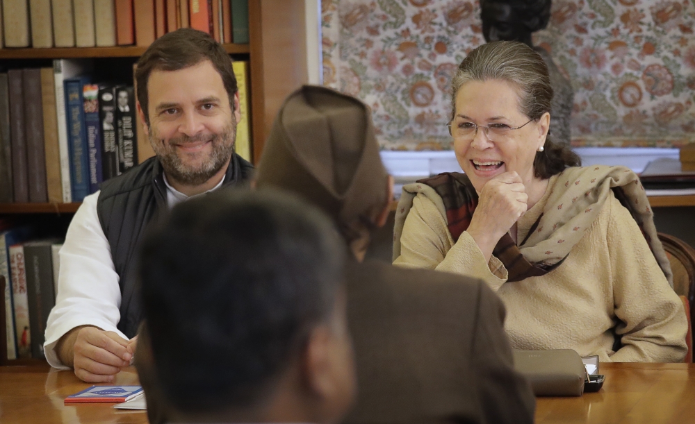 India’s main opposition Congress party president Sonia Gandhi, right, with party vice president and her son Rahul Gandhi, left, talks to Karan Singh during the Congress Working Committee (CWC) meeting in New Delhi, India, on Monday. — AP