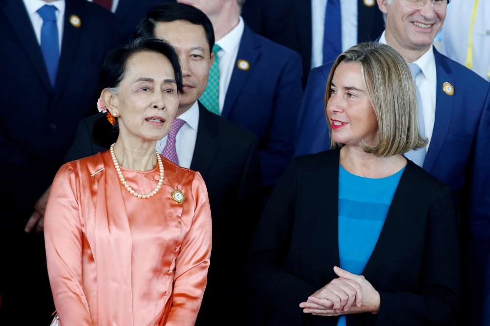 Myanmar State Counselor Aung San Suu Kyi talks with High Representative of European Union Federica Mogherini during the 13th Asia Europe Foreign Ministers Meeting (ASEM) in Naypyitaw, Myanmar, on Monday. — Reuters